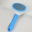 Blue dog grooming brush with soft grip handle for pet hair care